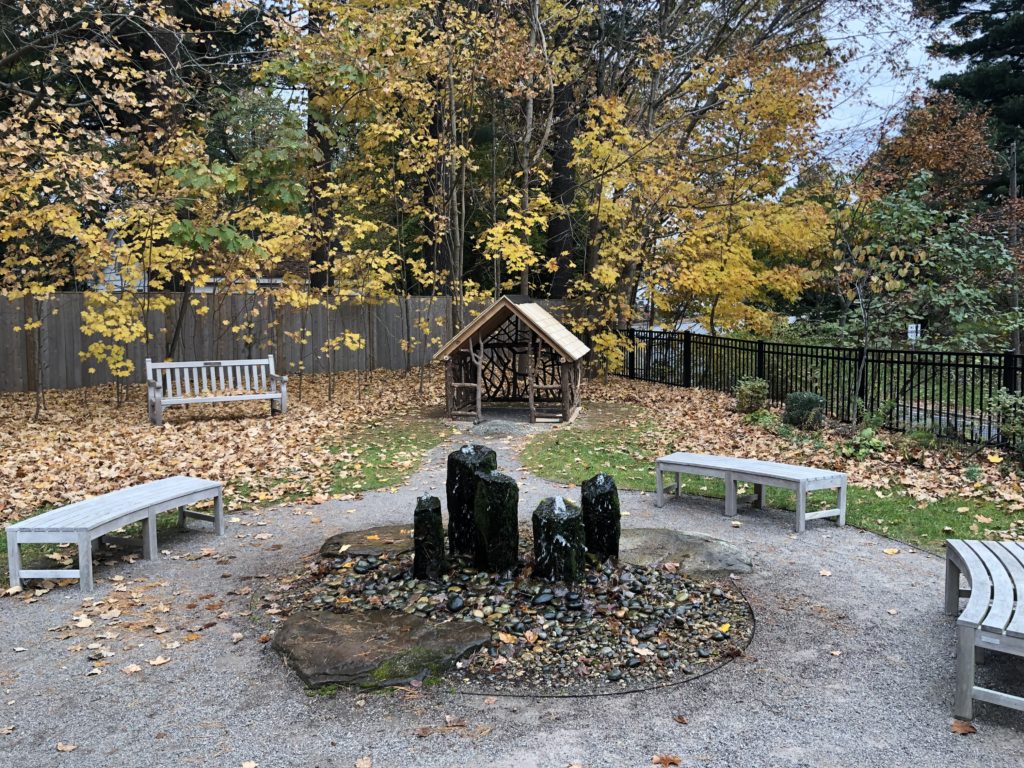 A view from inside the garden, centered on the fountain.