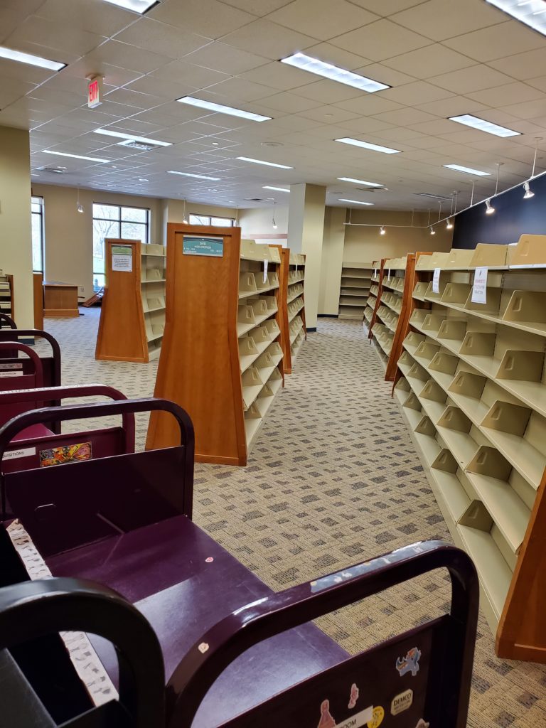 Empty shelves in the space that would eventually become the Commons.
