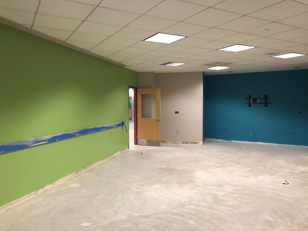 The inside of the Middle School Room with freshly painted green and blue walls.