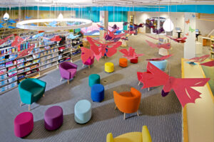 The newly-renovated Children's room. Stylized butterflies hang from the ceiling and overlook brightly-colored chairs.