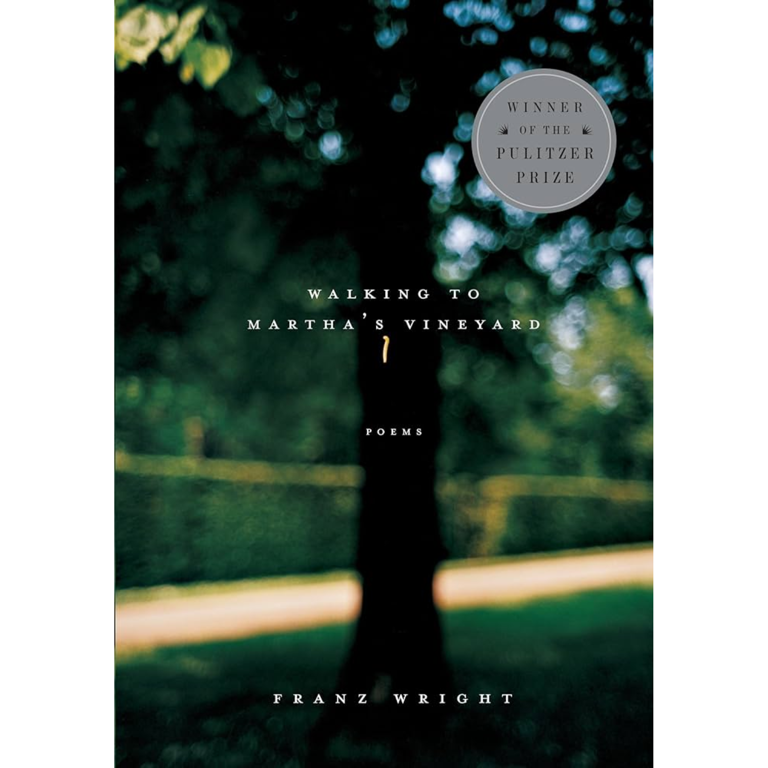 Cover art for "Walking to Martha's Vineyard." Cover tepics title text atop a photo of a blurred tree and hedge.